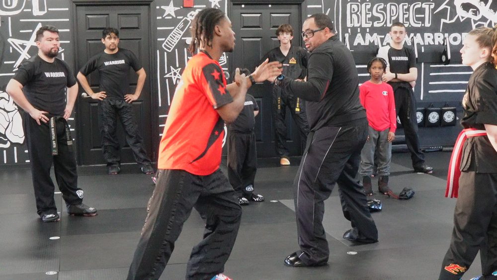 Teens and adults training together in class