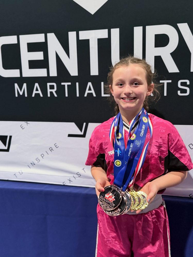 Lion Pride student with competition medals